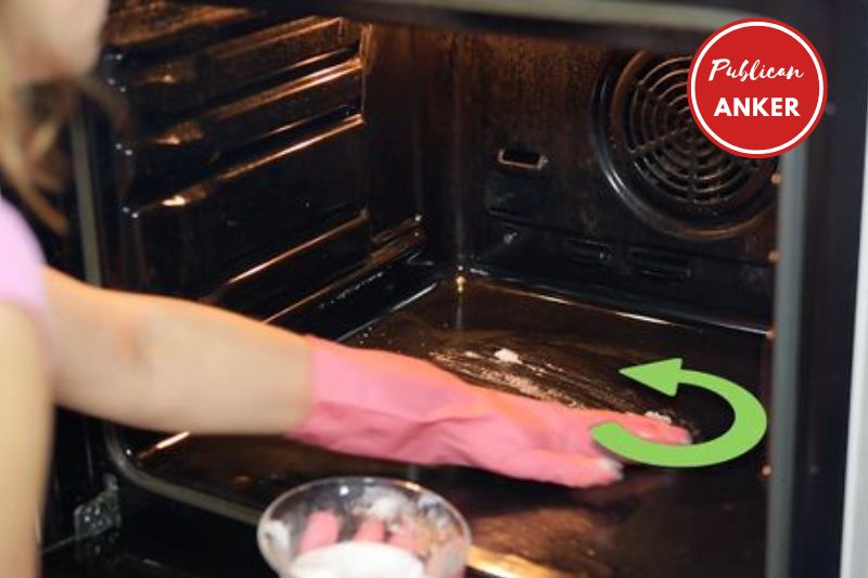 Coat the racks in baking soda paste on your sink or tub